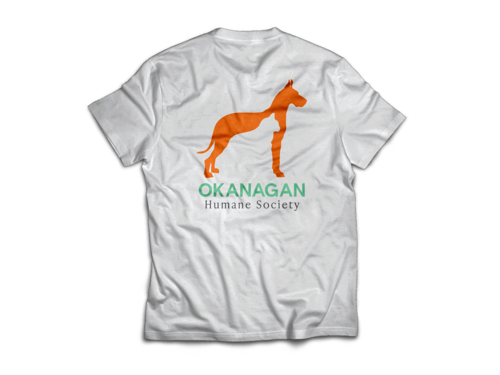 Back view of white t-shirt with Okanagan Humane Society logo showing an orange dog silhouette with a cat shape inside.