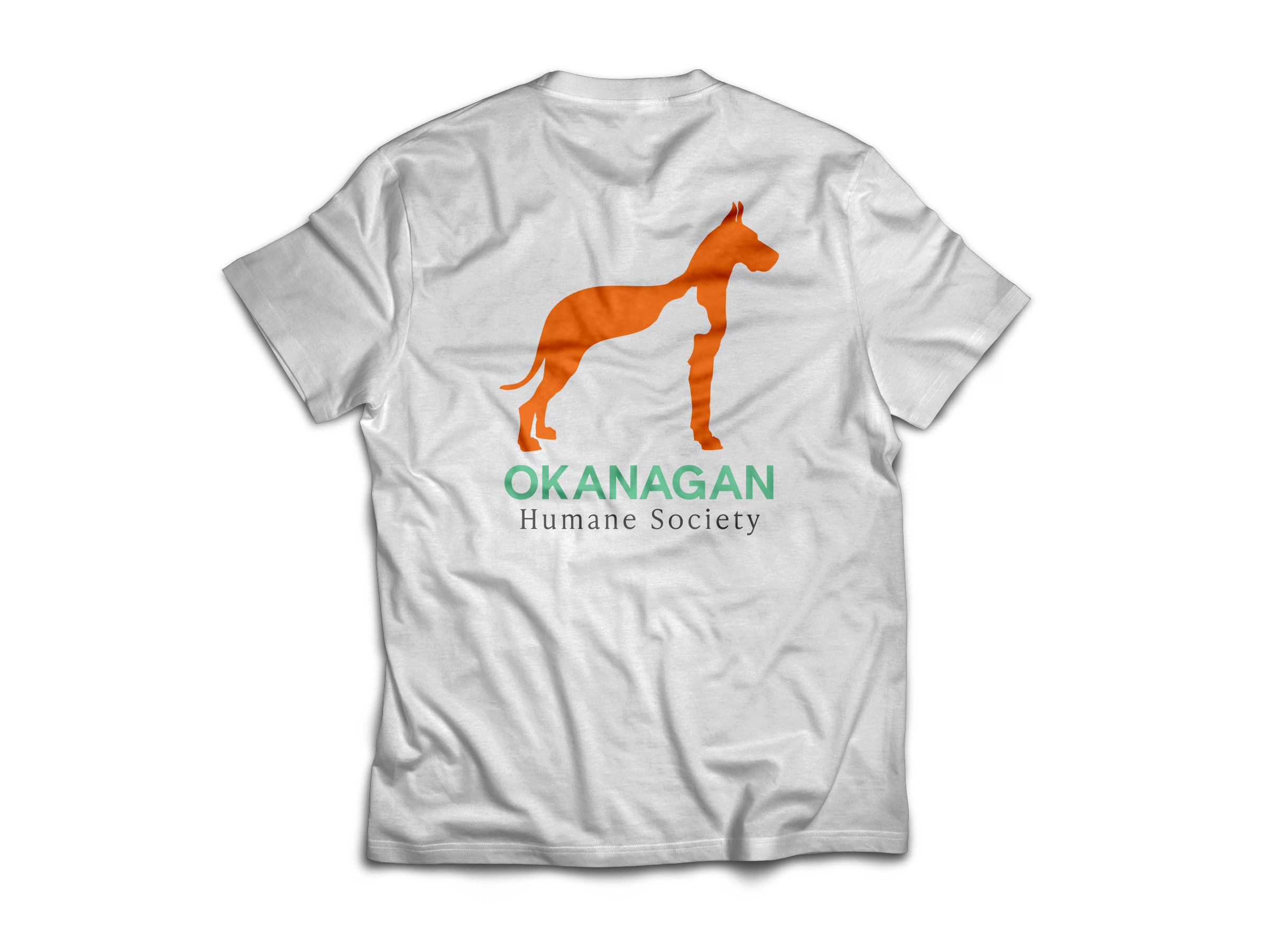 Back view of white t-shirt with Okanagan Humane Society logo showing an orange dog silhouette with a cat shape inside.